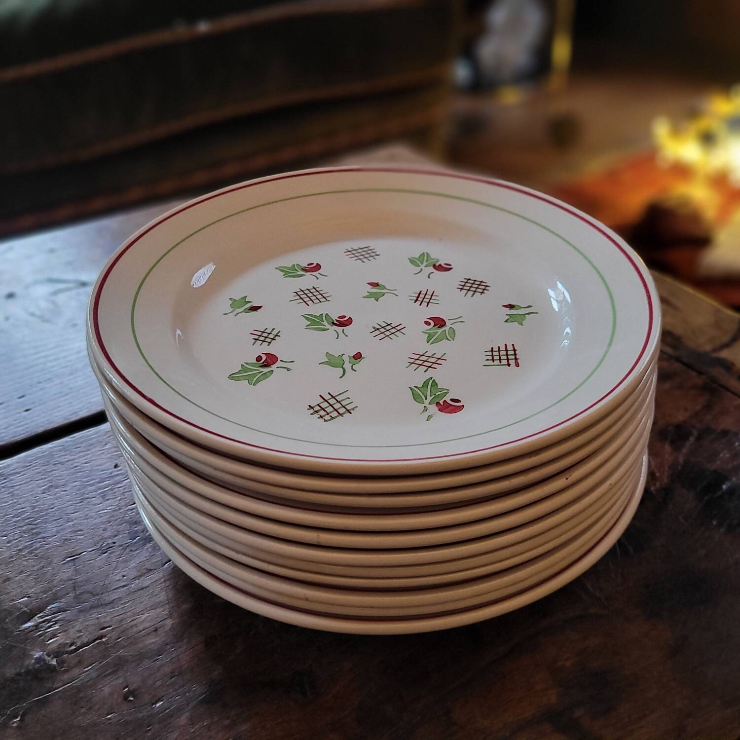 11 dinner plates decorated with stylized roses. 1950s. 11 dinner plates