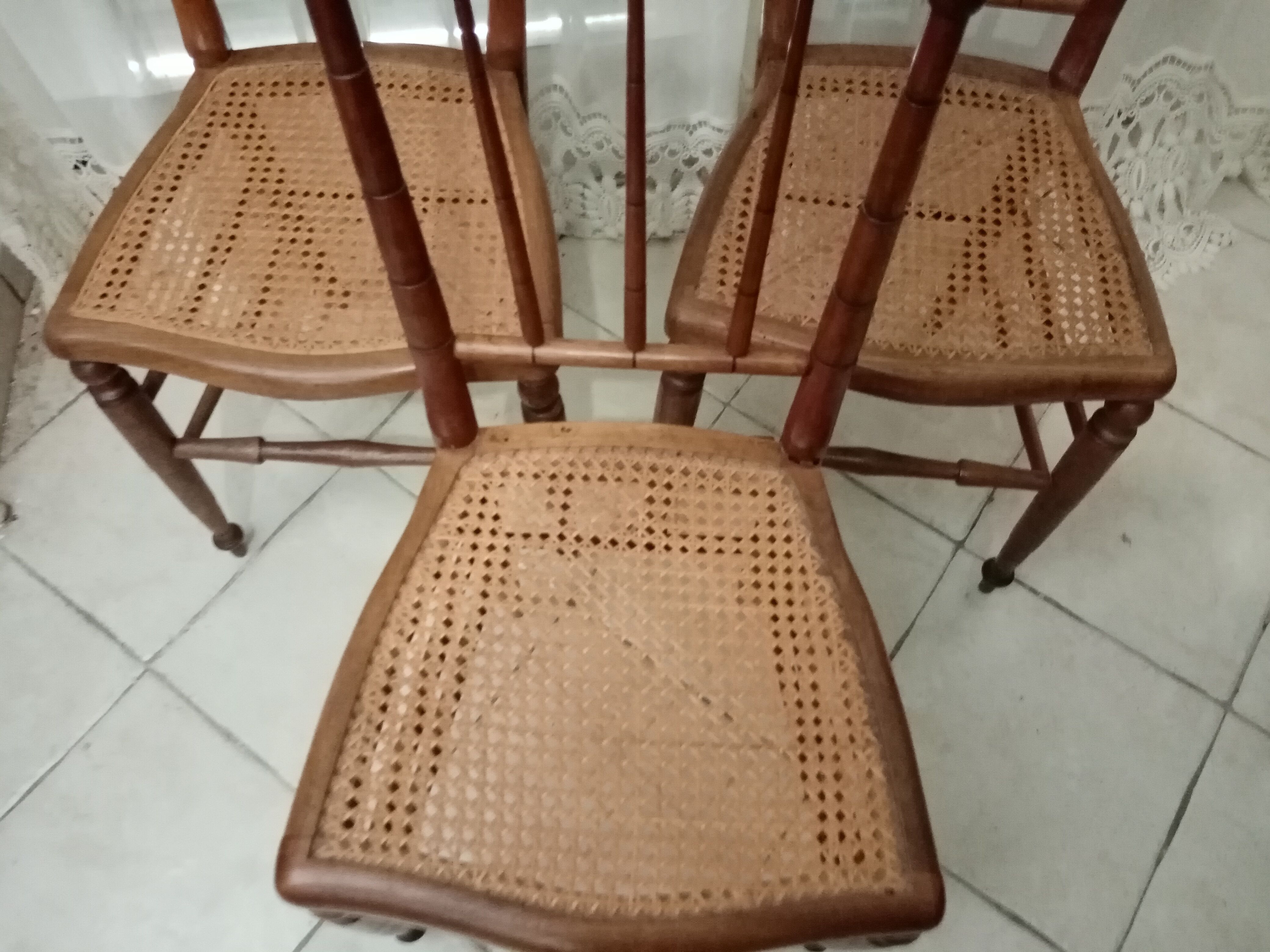 3 wooden and canning chairs