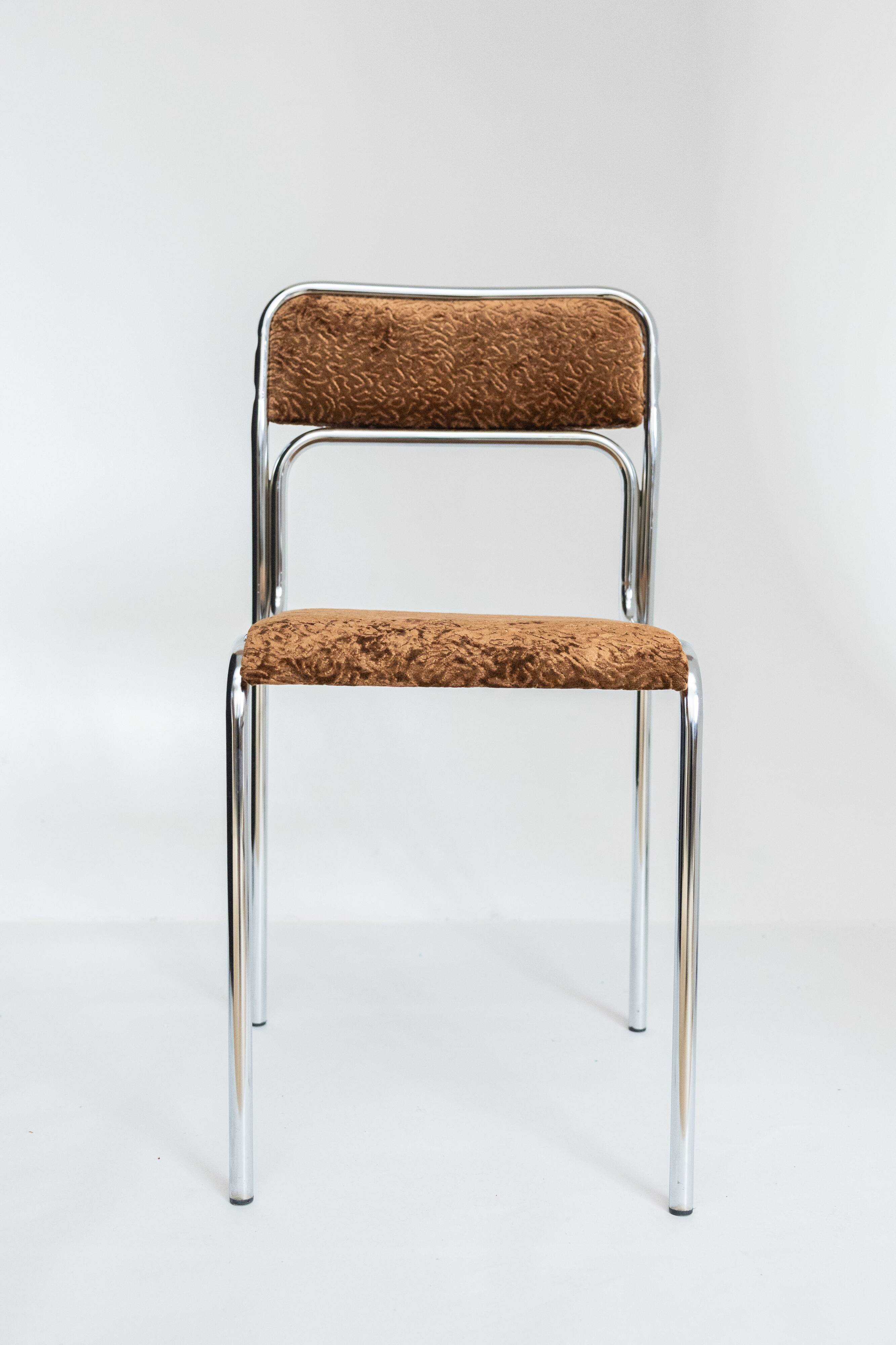Chrome dining chair upholstered in brown bitten velvet.