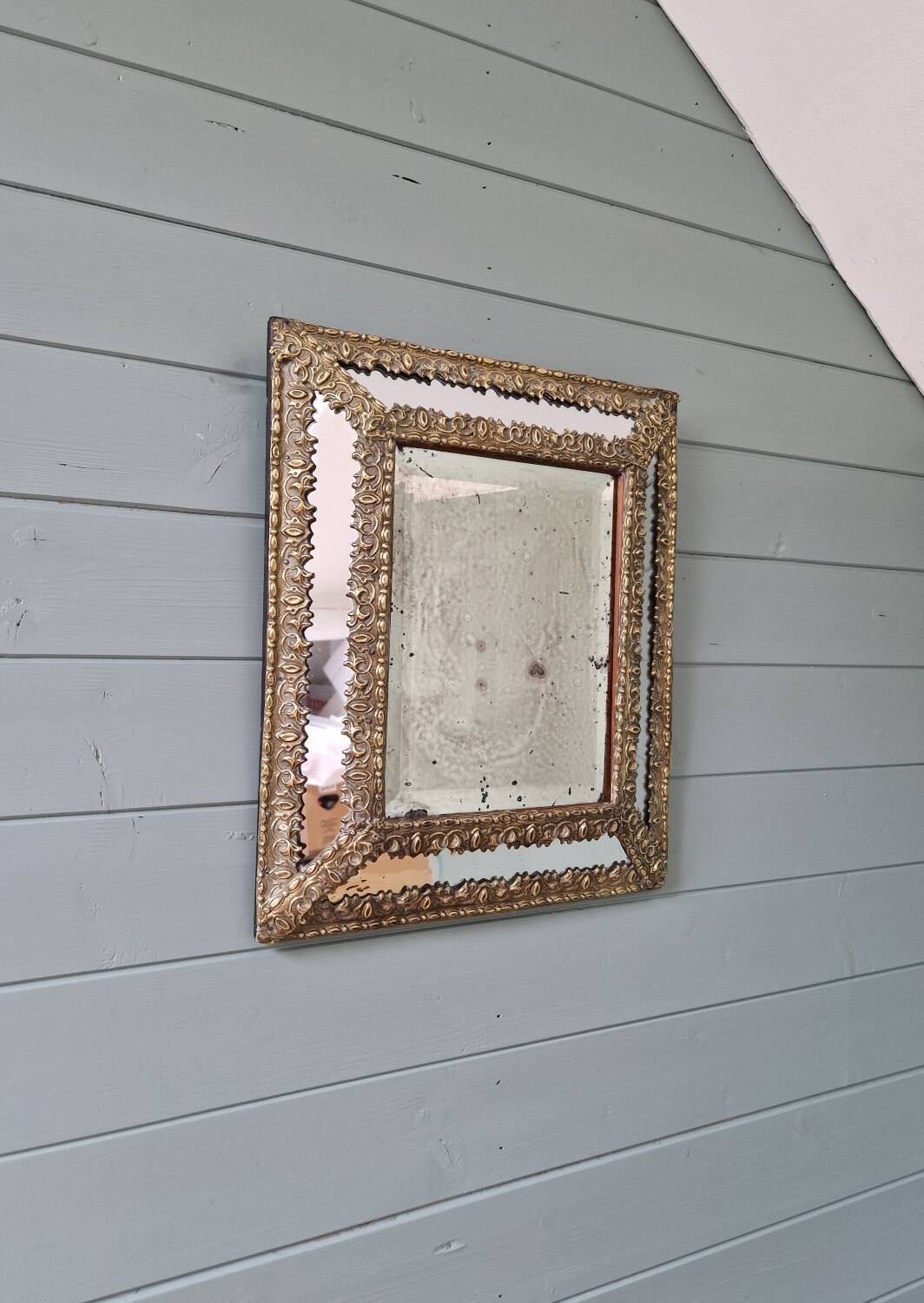 Mirror with embossed brass and mercury glass glazing beads, 19th century