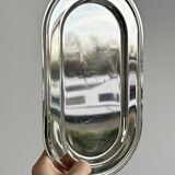Small antique tray made of lightweight metal.