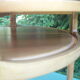 Round coffee table in solid walnut double tray of the 1970s