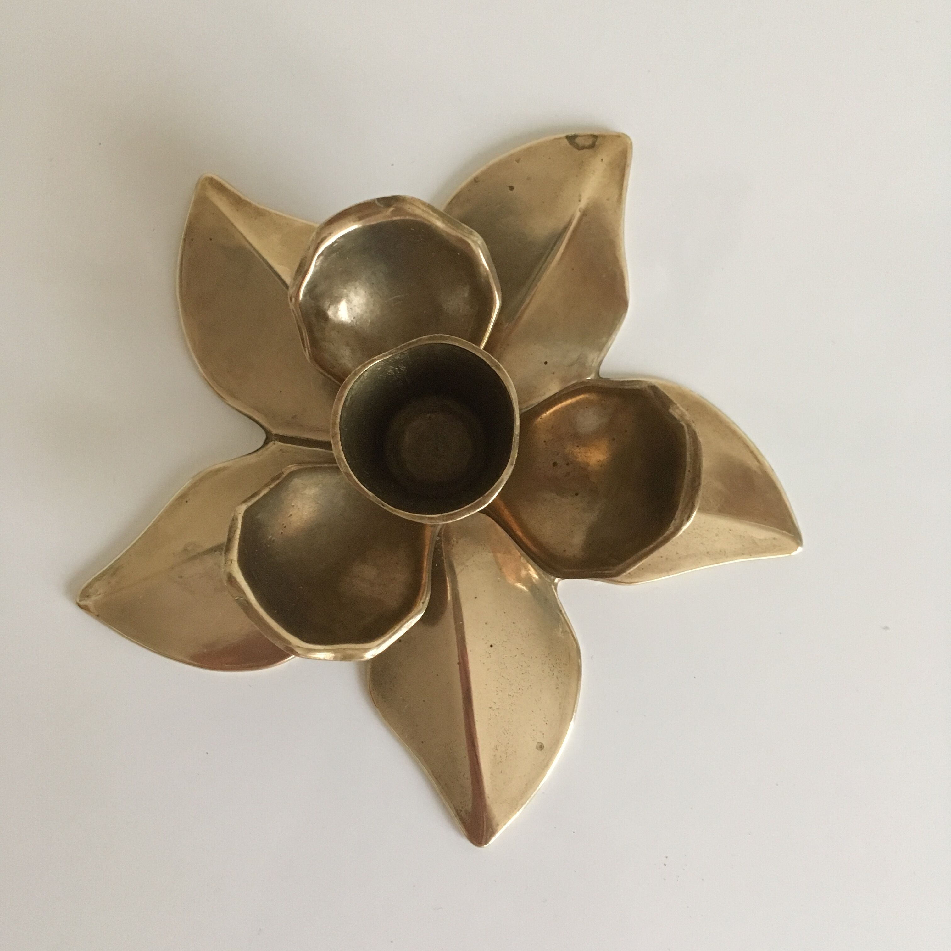 Flower-shaped brass candleholder