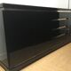 Wide row black lacquer and brass