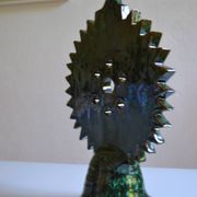 Green ceramic sun candlestick from Tamegroute, Morocco.