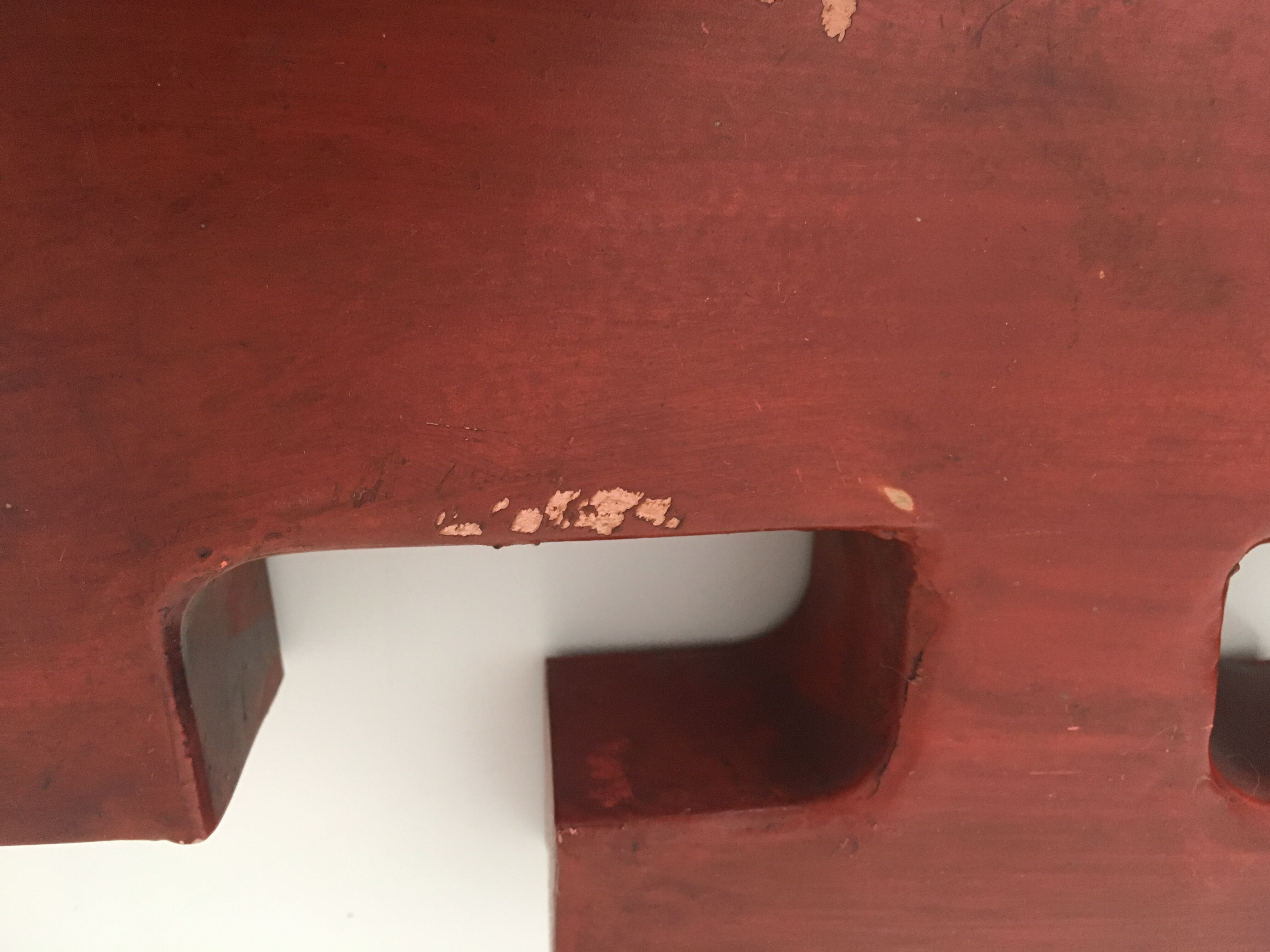 Red metal "F" sign letter