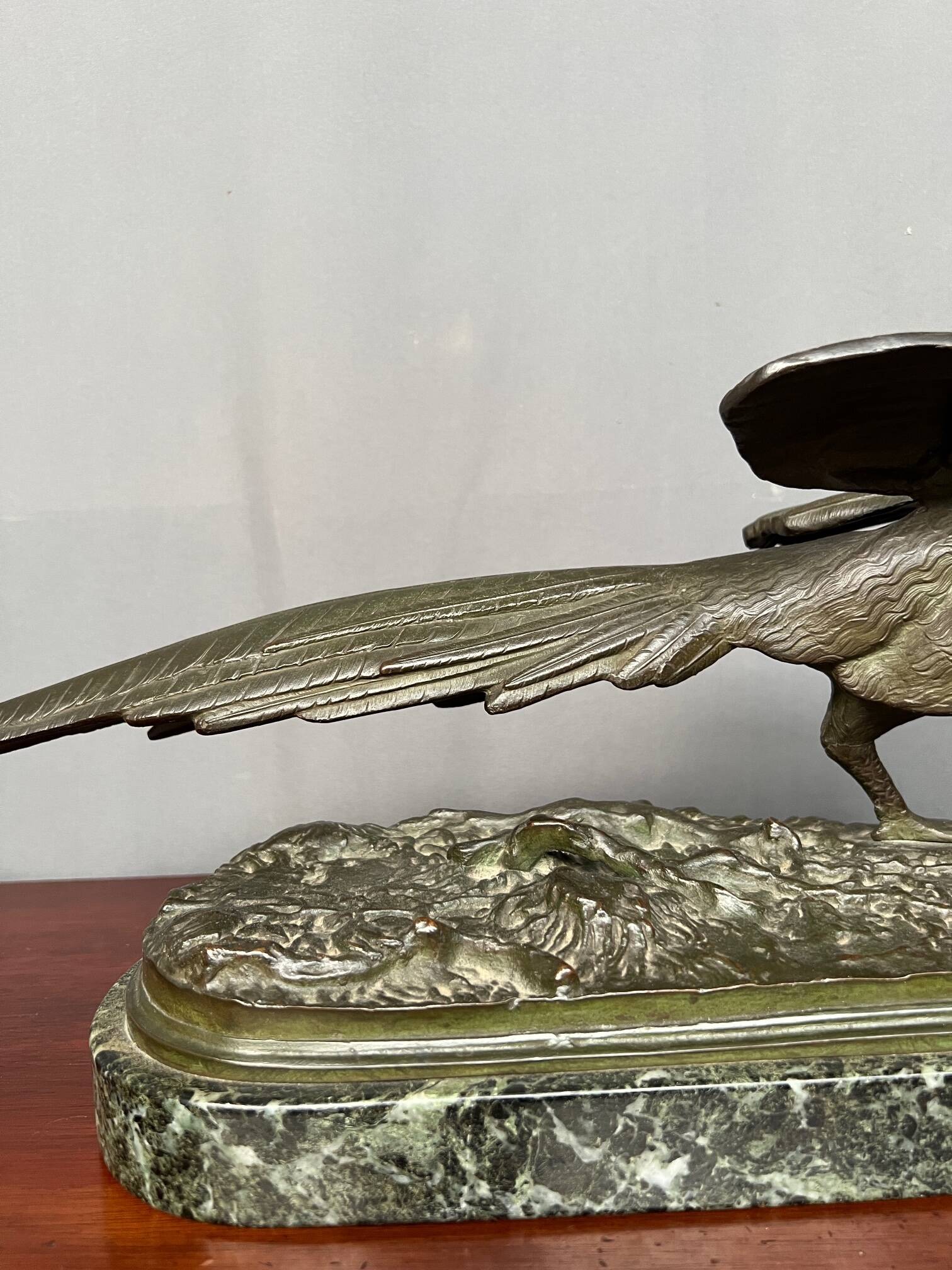 Rene Andre Varnier. Bronze figure of a pheasant on a green marble base.