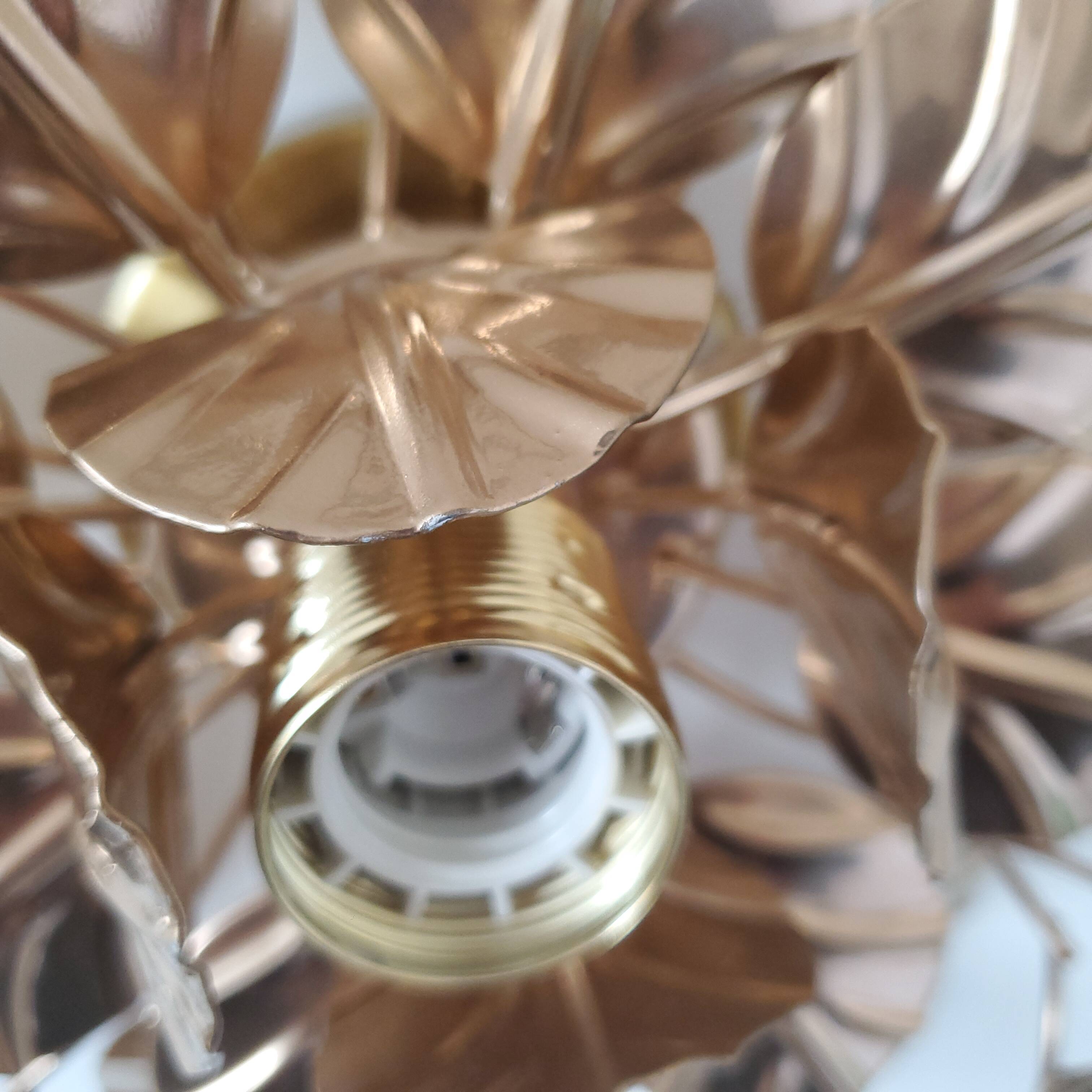 Golden metal flower sconces
