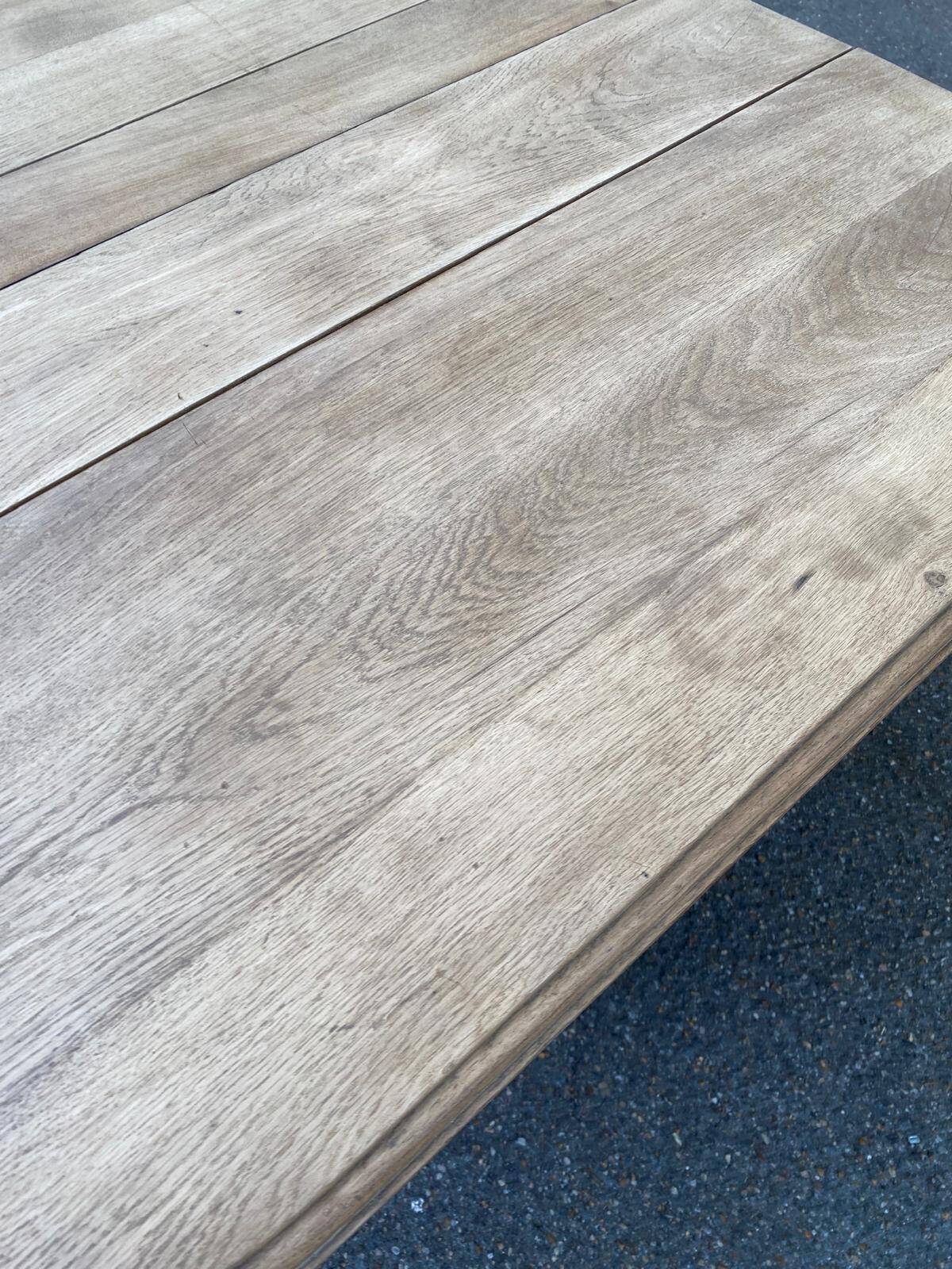 Rectangular Art Deco dining table with a central pedestal, stripped in solid oak.