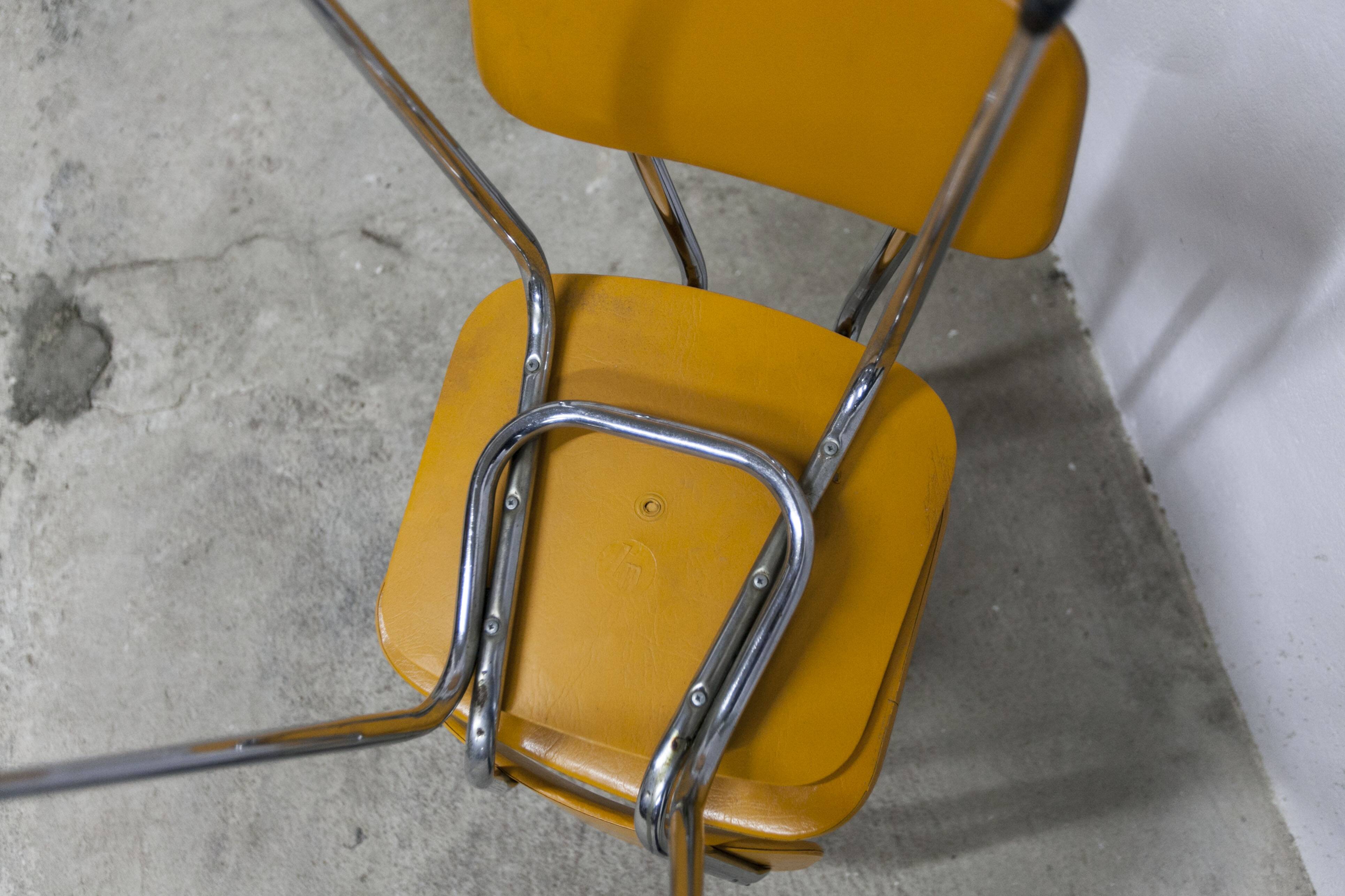 Pair of mustard-colored 70s welded Skai chairs