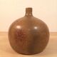Sandstone ball vase signed Michel Dumont