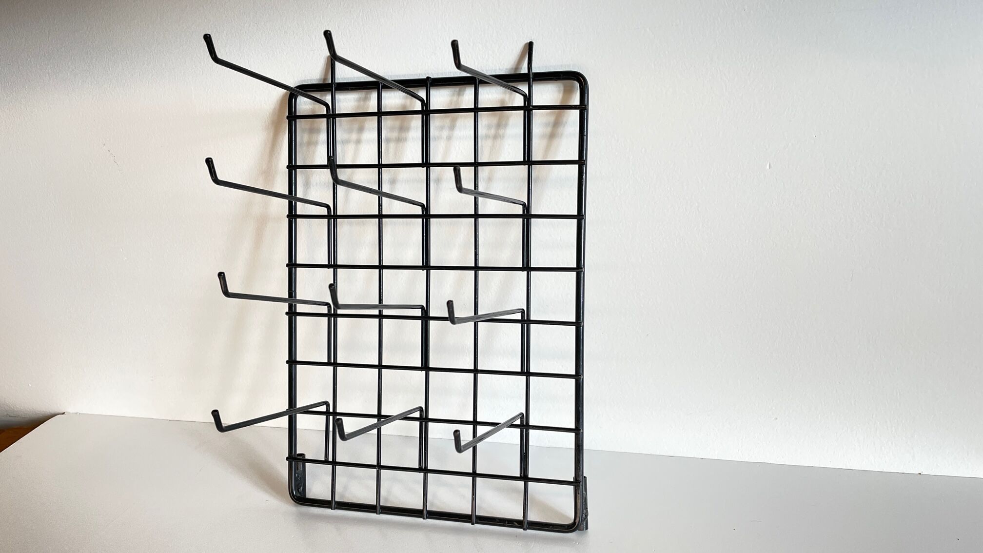 Vintage black metal wall loom display