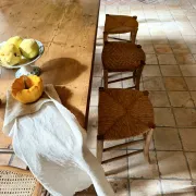 Campaign stool in rattan and wood