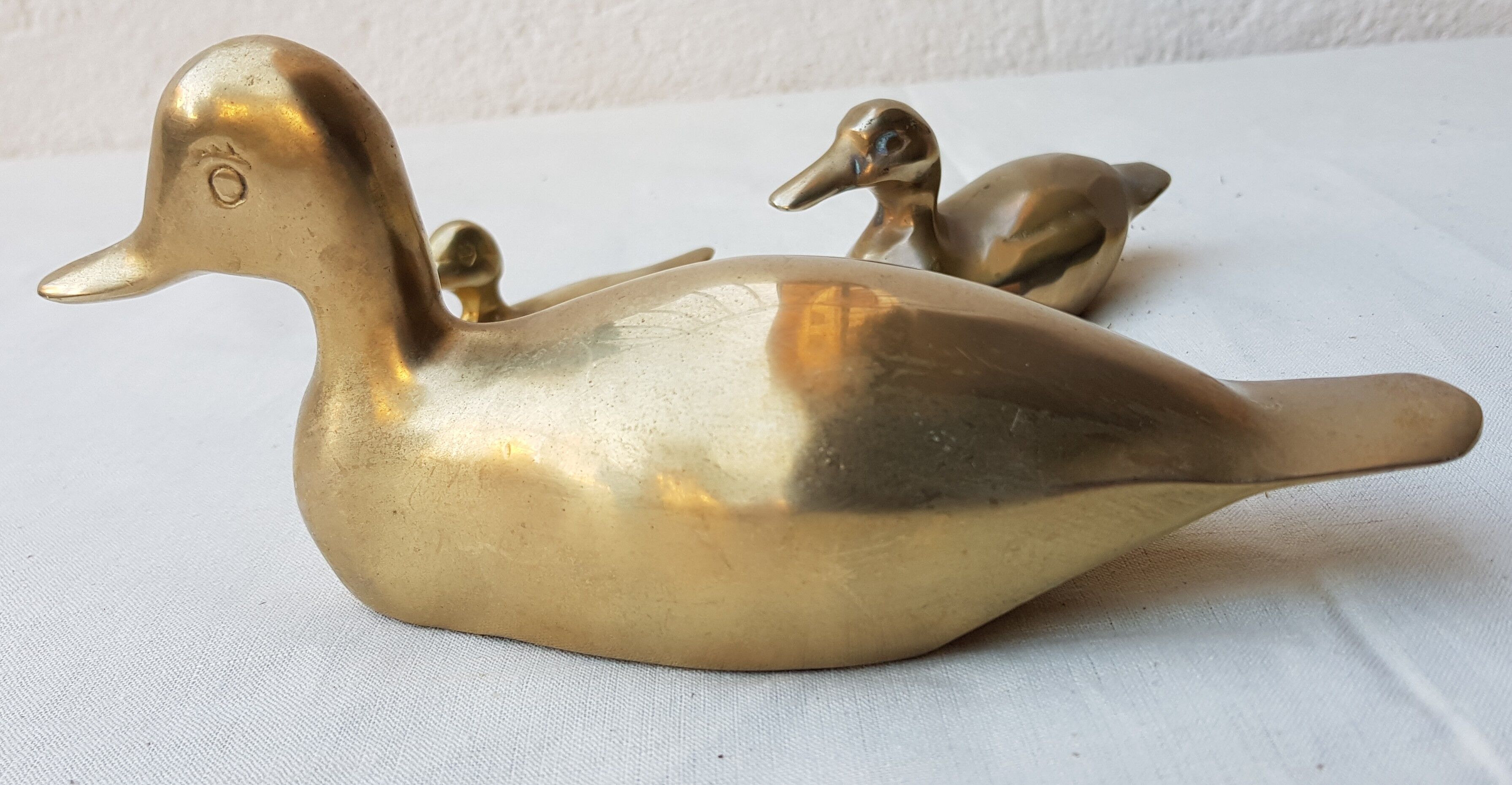 Trio of brass ducks