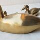 Trio of brass ducks