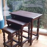 Nesting tables in oak wood. Turned wooden legs.