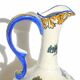 Gien earthenware jug, Renaissance decoration, putto with dolphin.