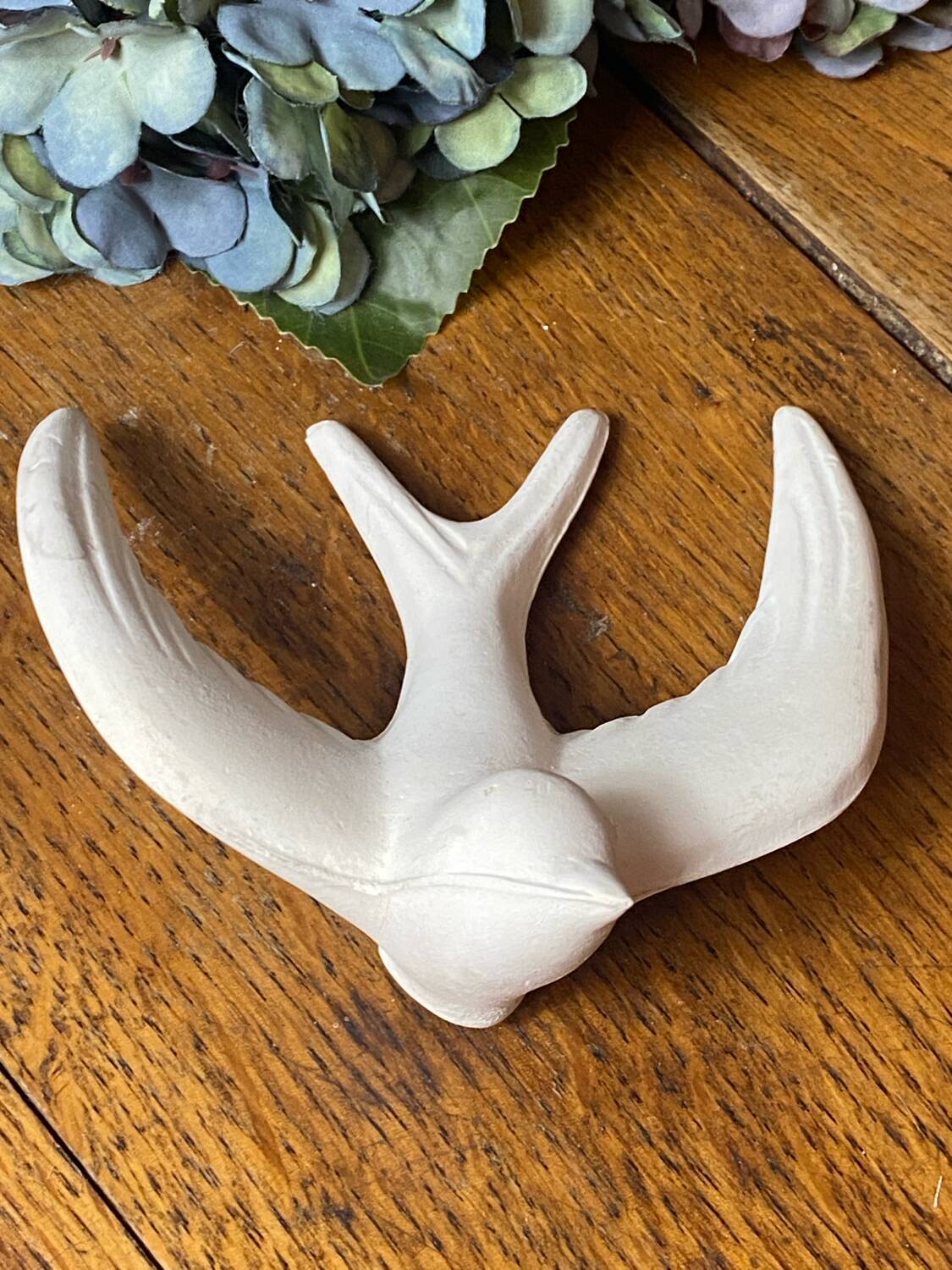 Pair of plaster swallows