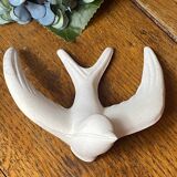 Pair of plaster swallows