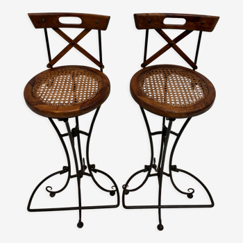 Pair of vintage wooden and wrought iron bar stools with tanned seating