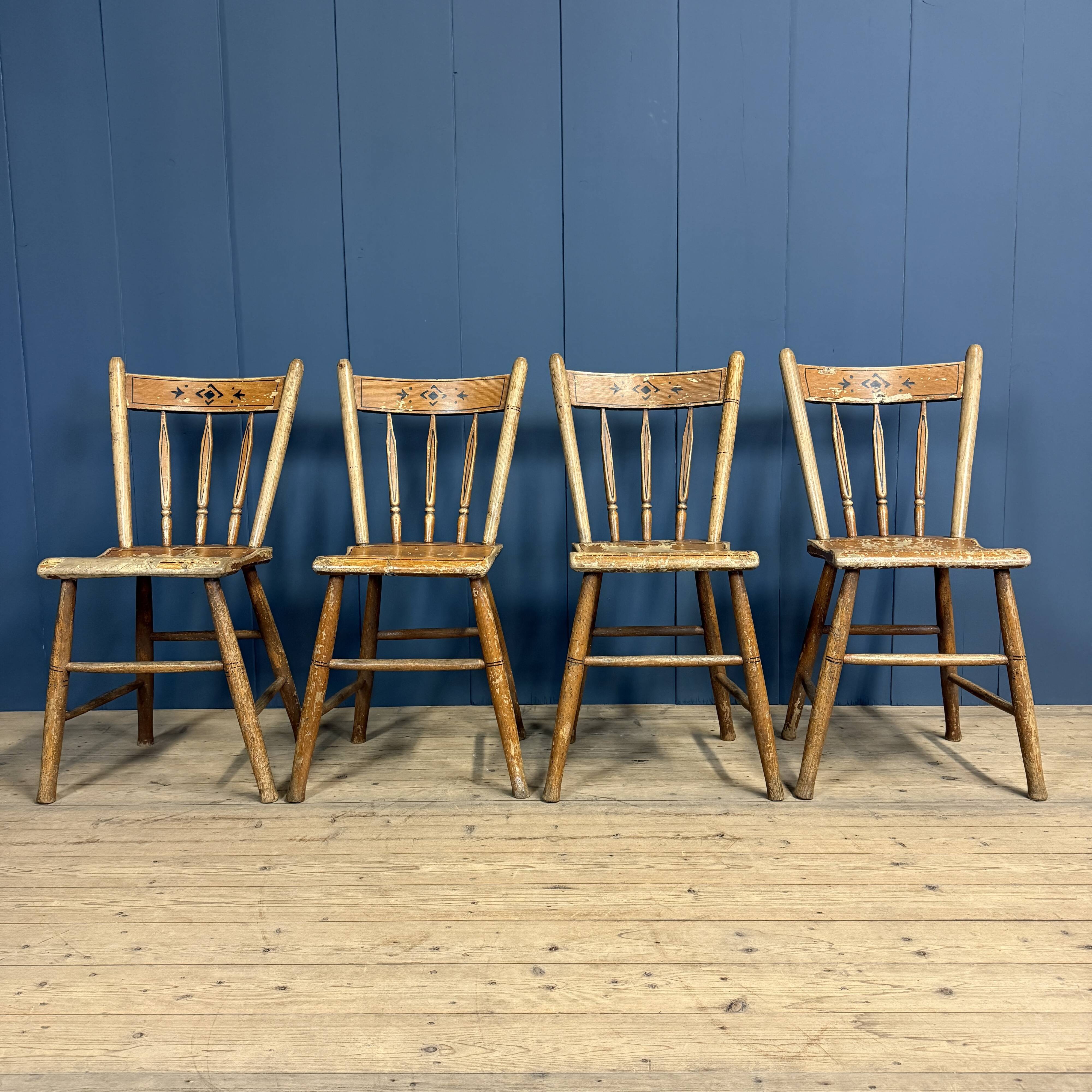 Set of four painted Dutch kitchen chairs.