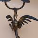 Pair of bronze candlesticks with chimera dragons