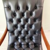 Black leather rocking Chesterfield armchair