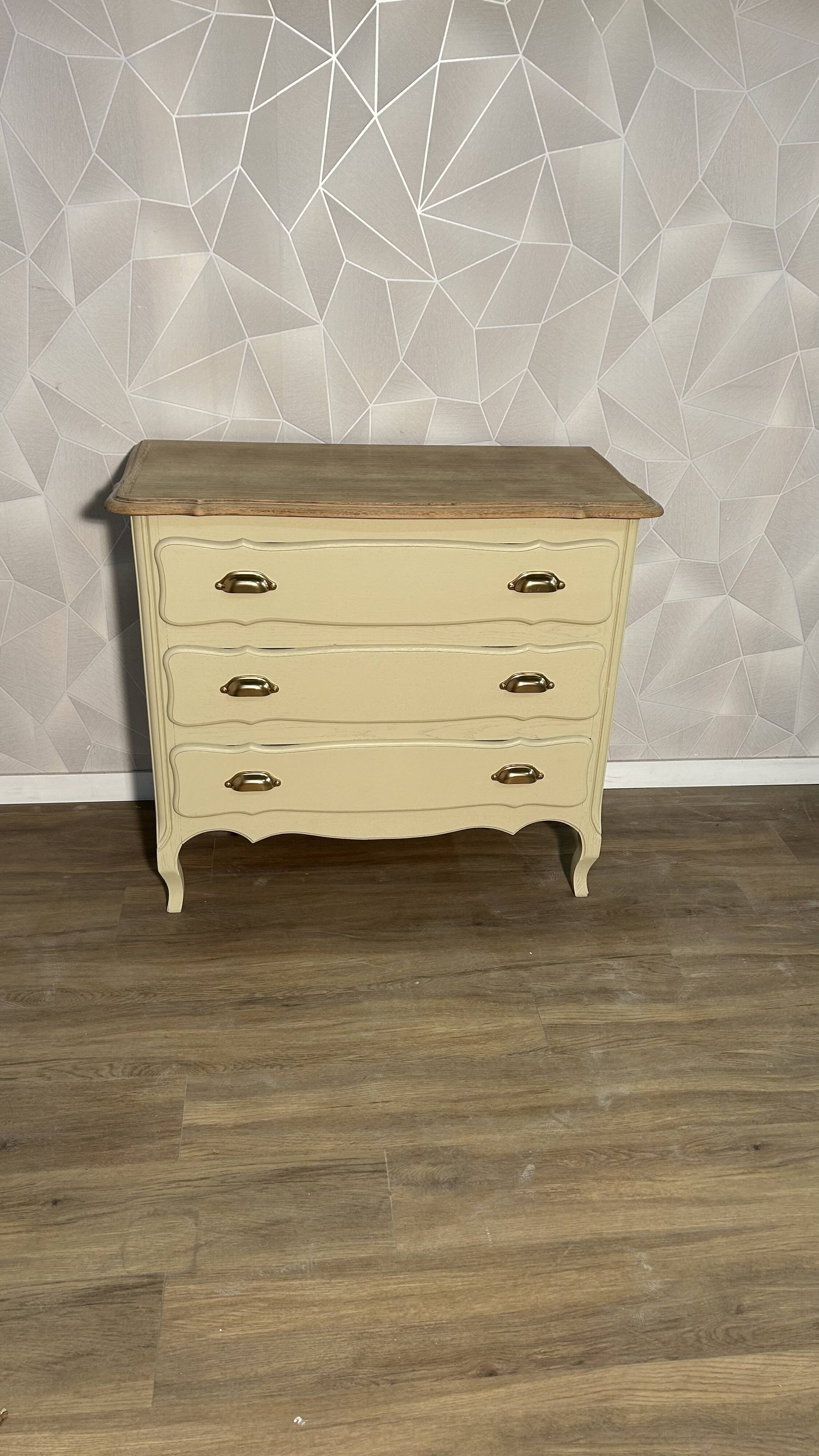 Old chest of drawers refurbished in beige cream