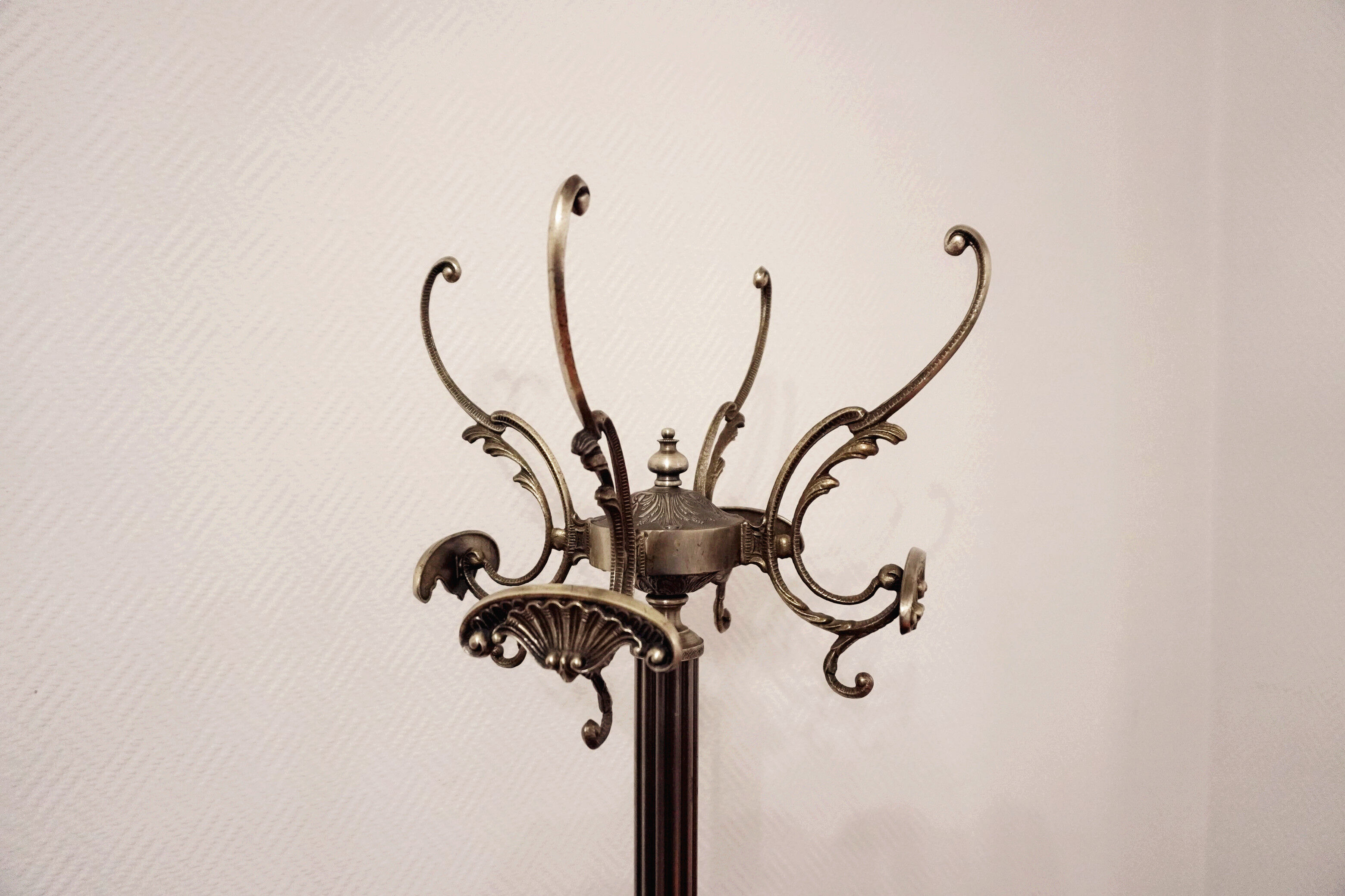 Brass revolving coat holder