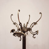 Brass revolving coat holder