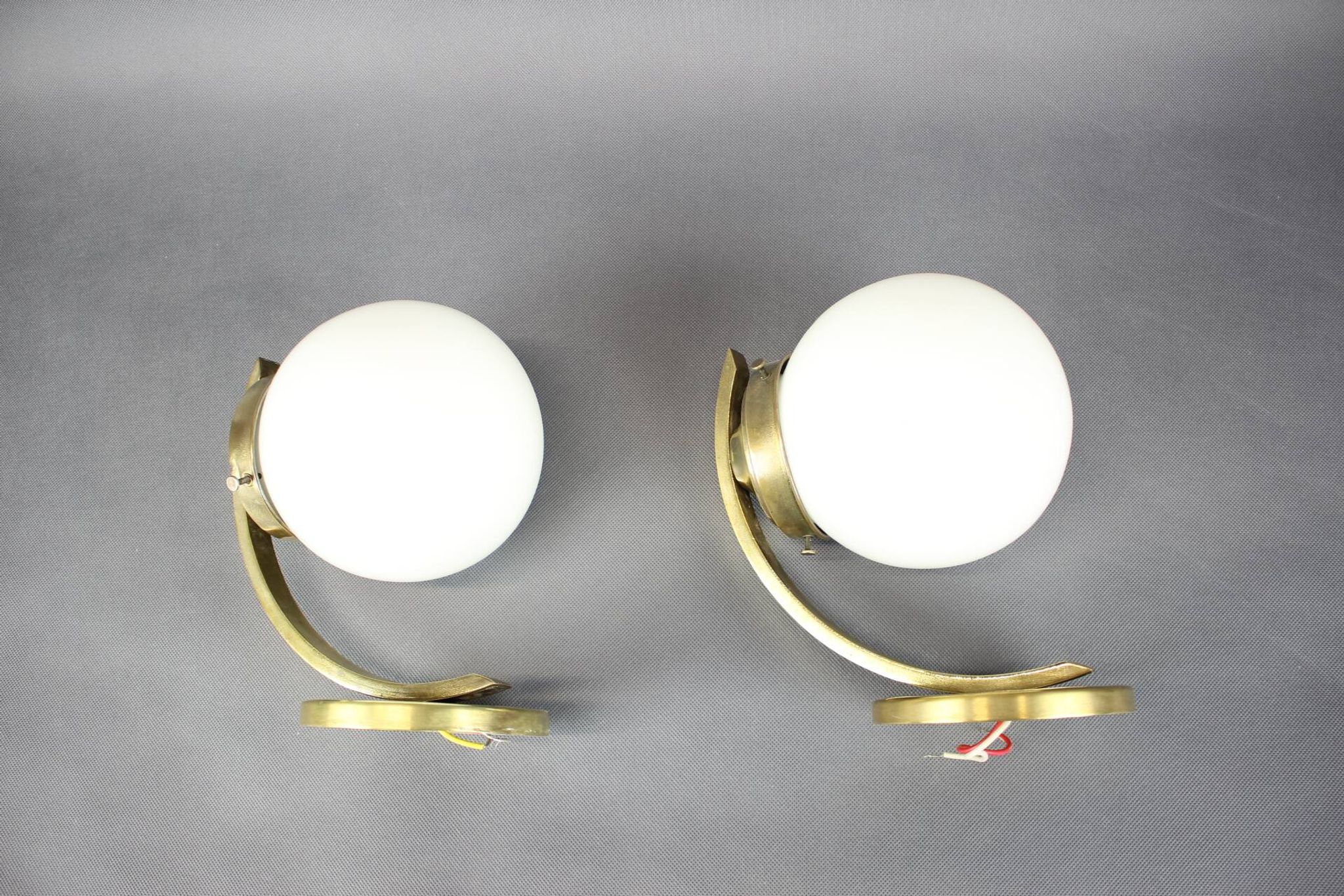 Pair of Art Deco wall sconces in brass and opaline glass, Europe, 1930s