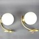 Pair of Art Deco wall sconces in brass and opaline glass, Europe, 1930s
