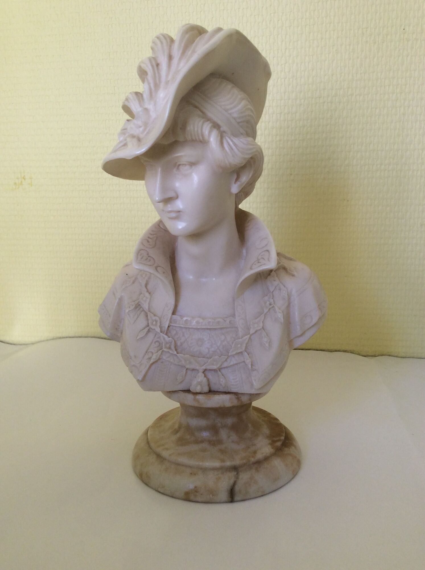 Bust of a young woman in the hat of A. Giannelli