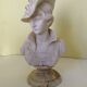 Bust of a young woman in the hat of A. Giannelli