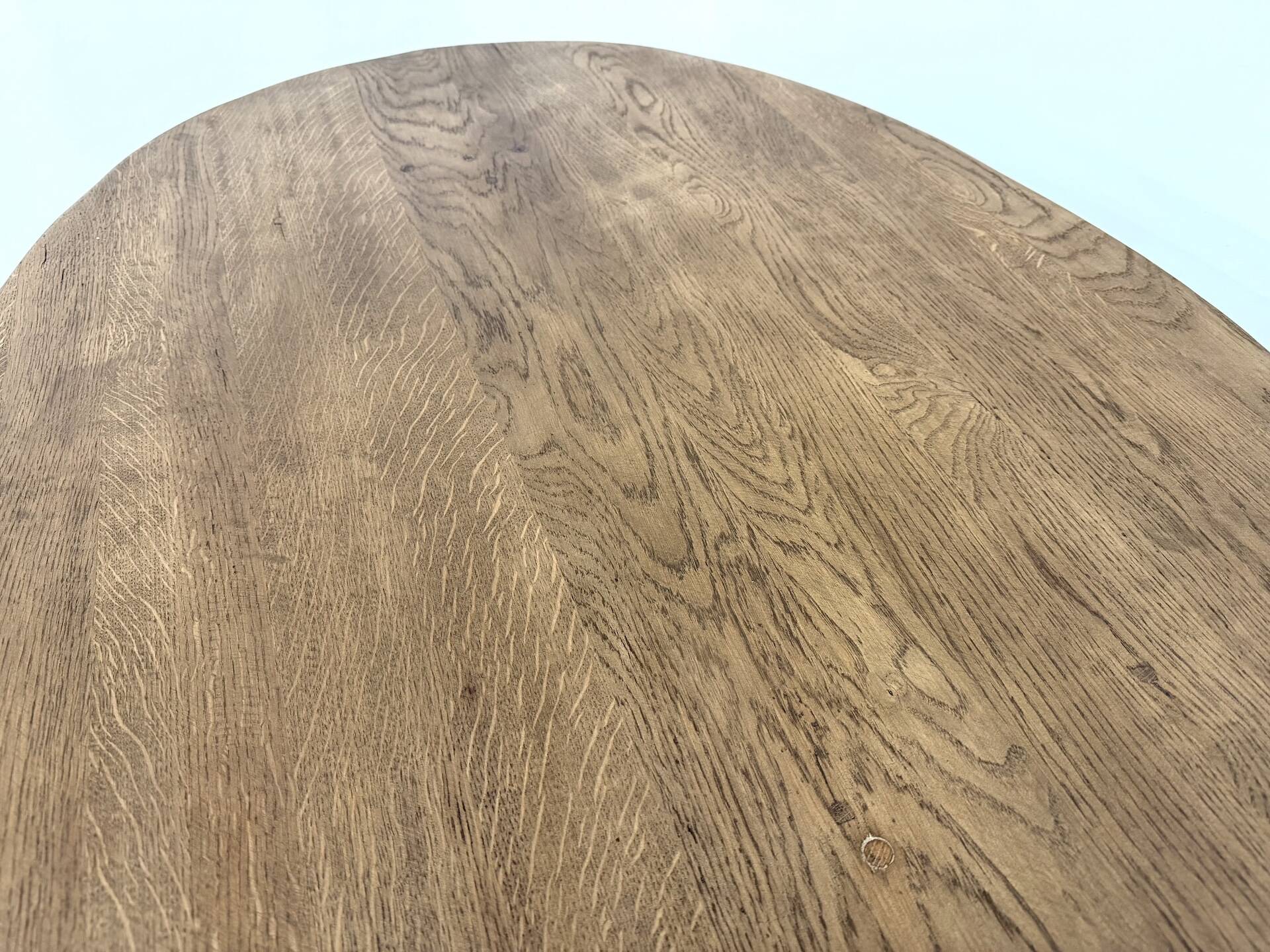 Oval table with T-shaped legs, solid oak, student woodworking project.