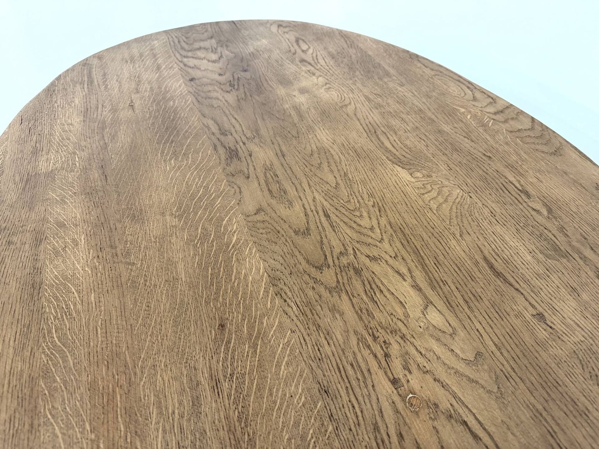 Oval table with T-shaped legs, solid oak, student woodworking project.
