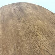 Oval table with T-shaped legs, solid oak, student woodworking project.