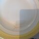 Six white hollow plates on board yellow Monaco 60
