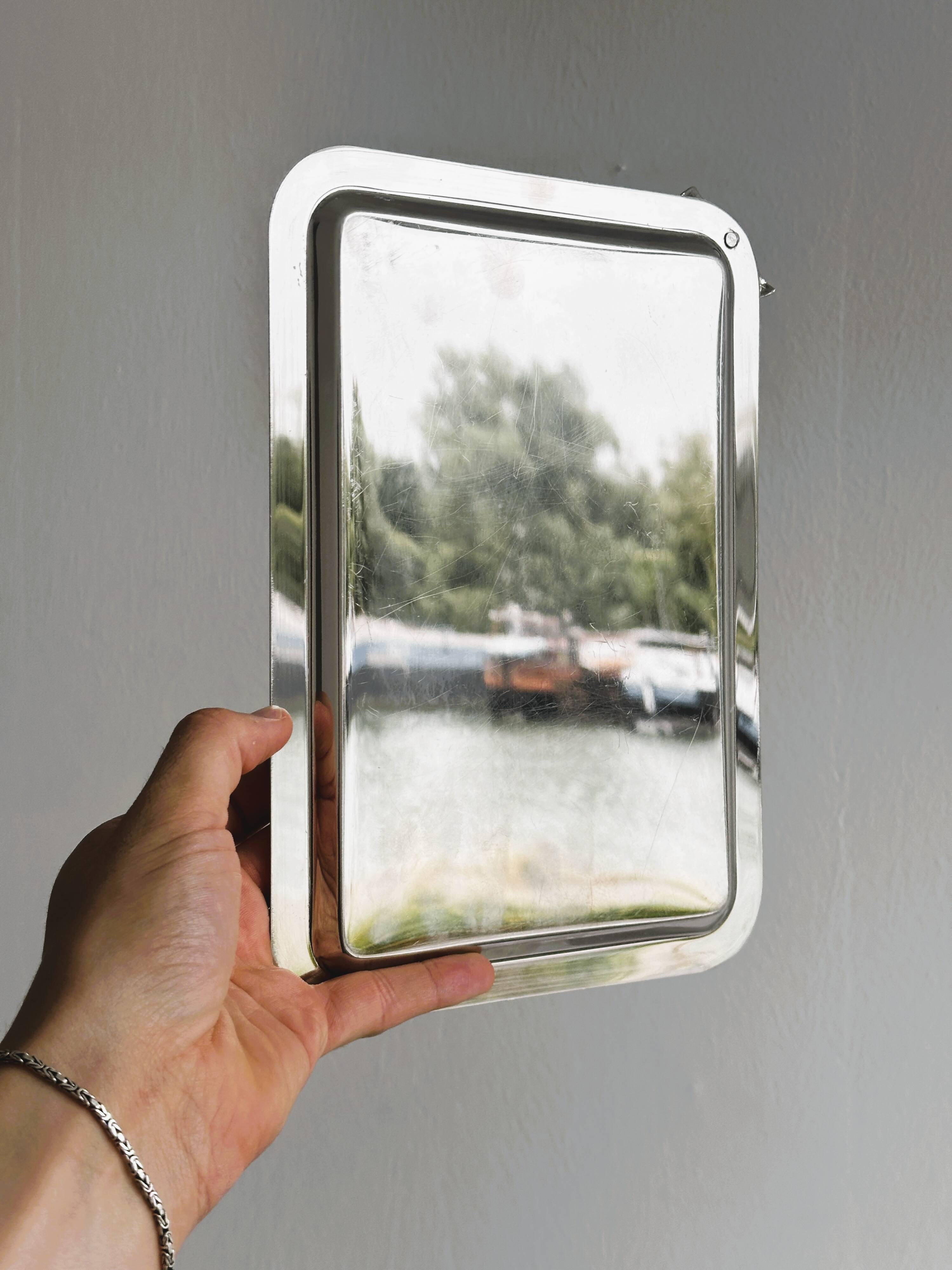 Small vintage metal tray with decorative knot