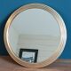 Mirror round surround patinated gilded brass metal