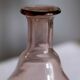 Blown glass vase moves purple