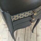 Bedside or nightstand painted black with patterns