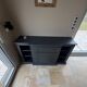 Low buffet with niches, chic country style, anthracite black, wood.