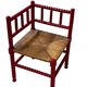 Red turned wood corner chair with rush seating