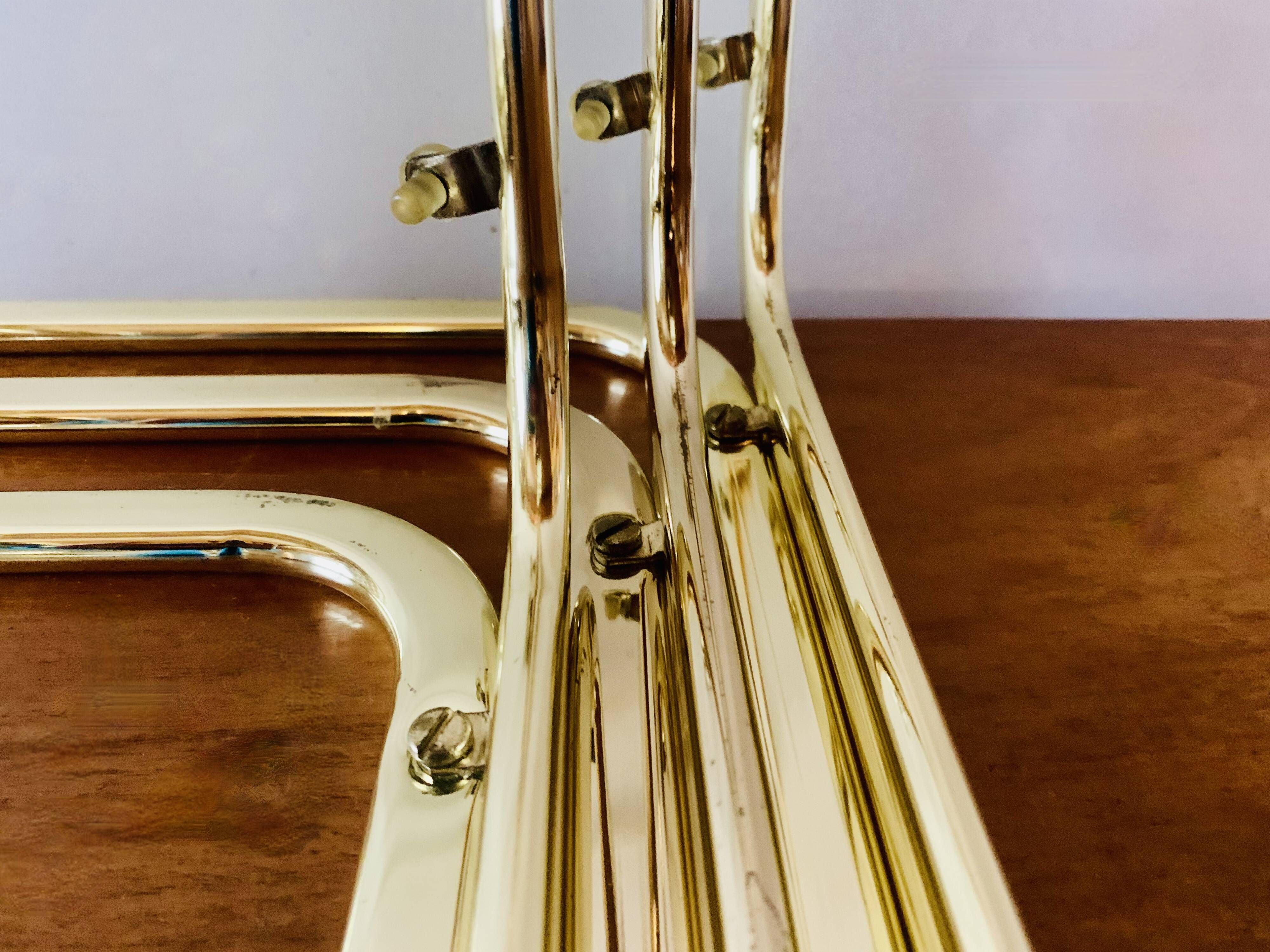 Vintage nesting tables in gold metal and smoked glass