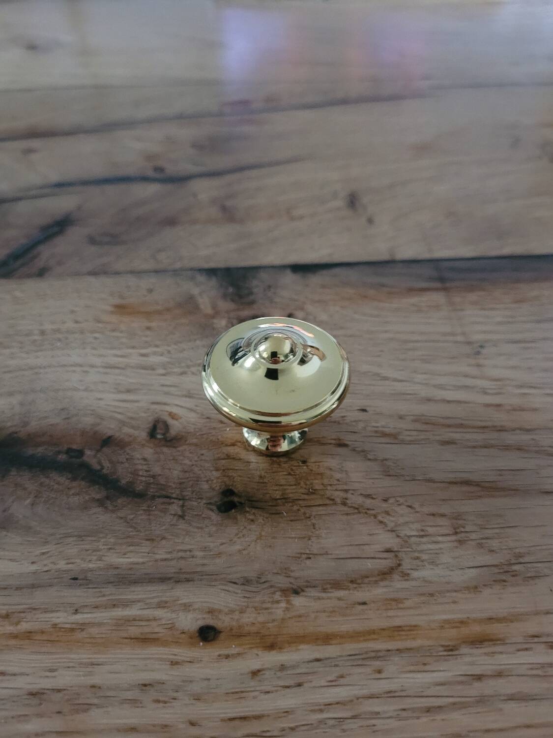 Polished brass furniture knobs