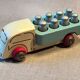 Small wooden milk truck with its cans, antique toy