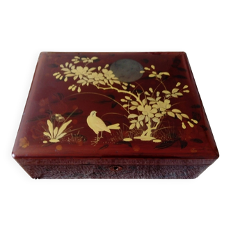 Old lacquered wooden box with golden asian decoration