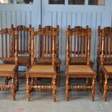 Set of 8 tanned chairs.