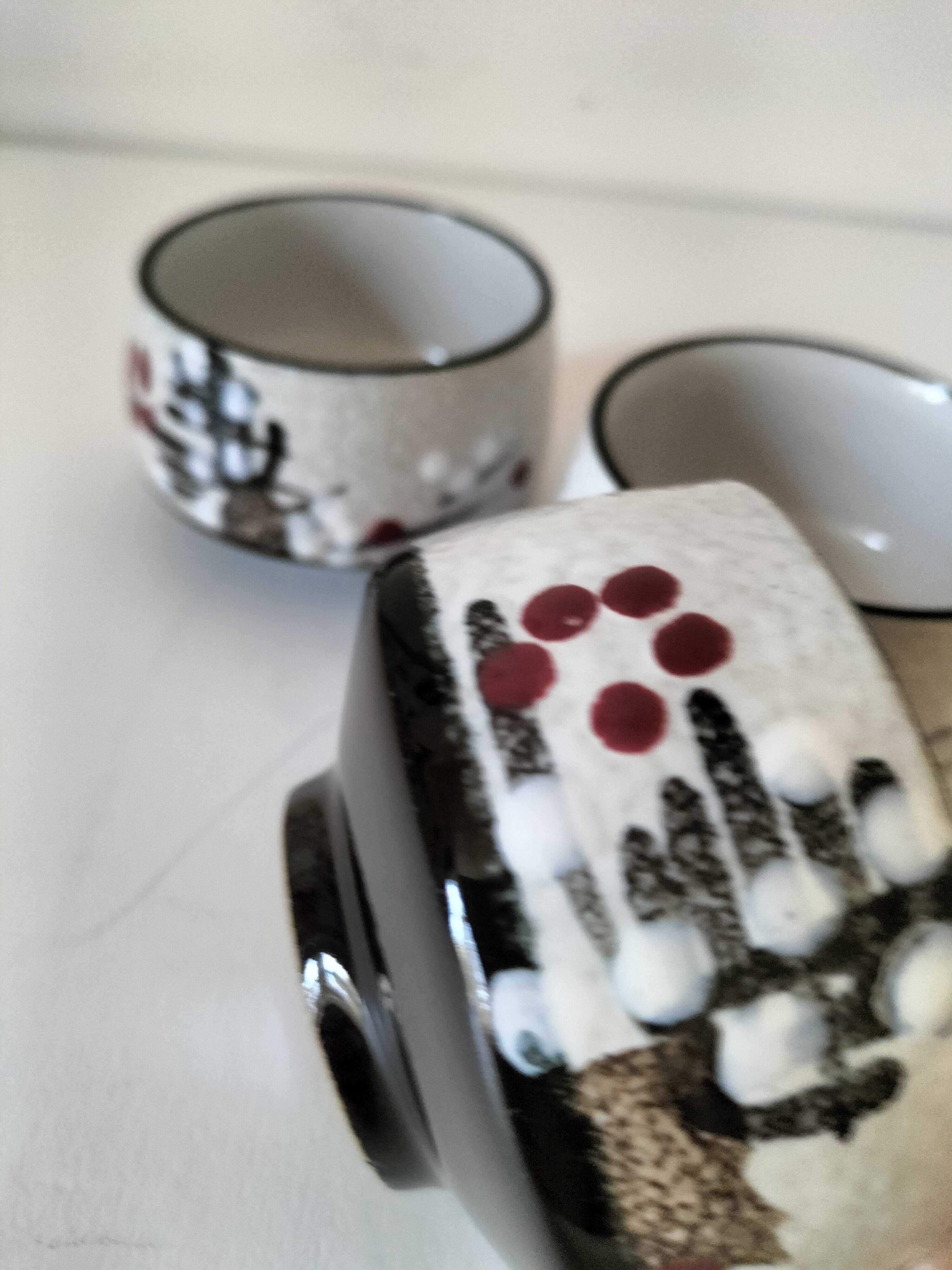 Three glazed ceramic bowls with raised graphic decoration, 1970s.